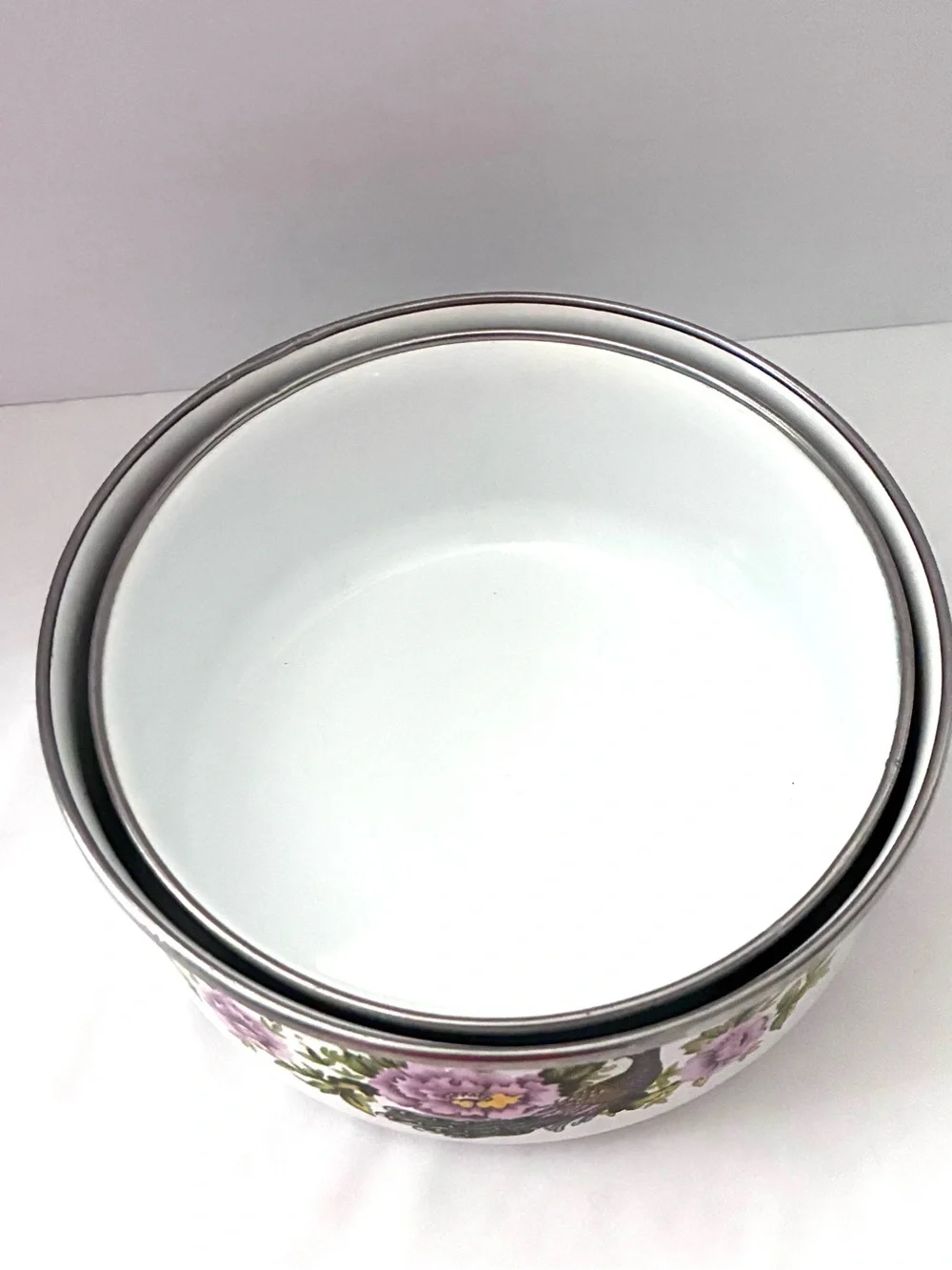 Vintage enamel mixing bowls featuring peacock and floral pattern